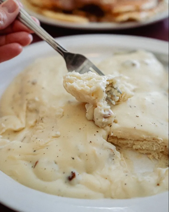 Biscuits covered in gravy at The Breakfast Club.